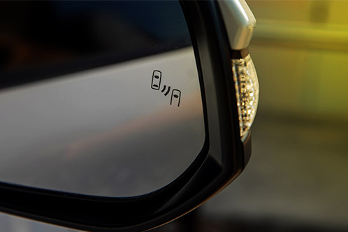 Side mirror labeled 