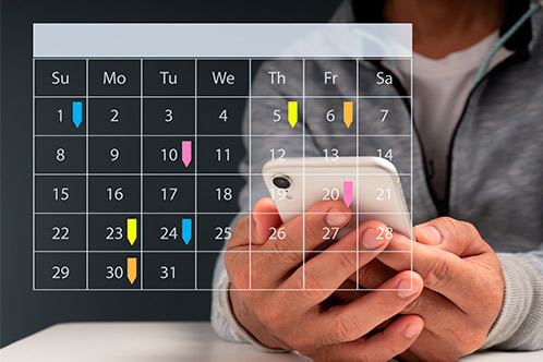 Individual with a cell phone showing a calendar event for finishing 6-hour Texas Adult Drivers Ed this weekend.