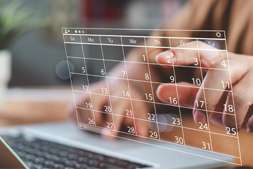 Time management concept. Businessman manages time for effective work. Calendar on the virtual screen interface. Highlight appointment reminders and meeting agenda on the calendar.